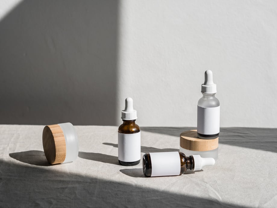 White and Brown Bottles on White Table